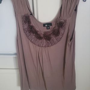 Taupe tank top with feminine rosette neckline